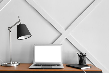 Modern stylish workplace with laptop in office