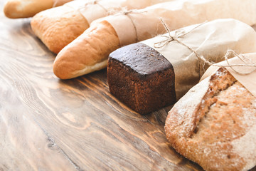 Assortment of bread on wooden background