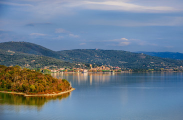 Fototapeta na wymiar View of Lake Trasimeno with the small town of Passignano in Umbria from Isola Maggiore