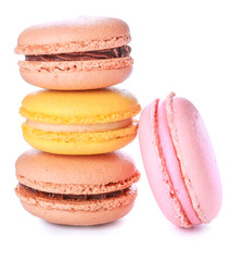 Different tasty macarons on white background