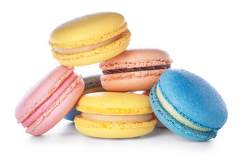 Different tasty macarons on white background