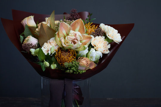 Bouquet in pastel colors in vintage style on a dark background, selective focus