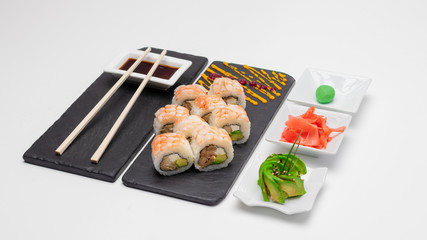 Images of an exquisite selection of sushi rolls of varied flavors and textures made in Concepcion, Chile.