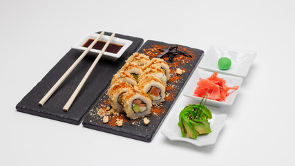 Images of an exquisite selection of sushi rolls of varied flavors and textures made in Concepcion, Chile.