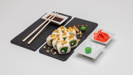 Images of an exquisite selection of sushi rolls of varied flavors and textures made in Concepcion, Chile.