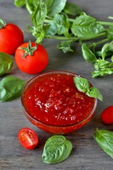 tomato jam. Jam from tomatoes with basil. Soft focus. Place for text. Copy Space.