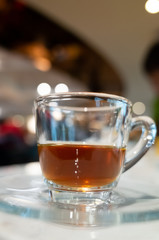 cup of coffee in glass on table