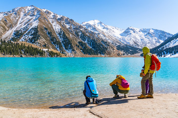 Lake with turquoise water surrounded by a mountain massif. Big Almaty lake in the mountains. Kazakhstan