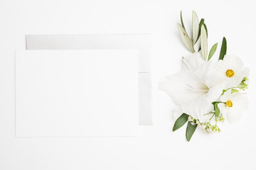 White Stationery blank page with flowers romanceflat lay
