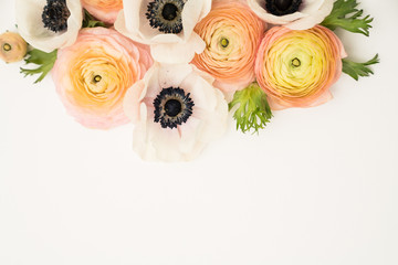 Ranunculus and anemone flower background floral feminine flat lay