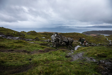 Old Man of Storr on the Isle of Skye in Scotland. Mountain landscape with foggy clouds.