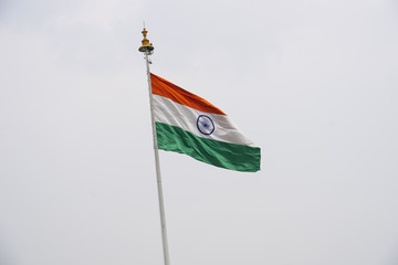 Image of india flag wavy in the sky with white fog.