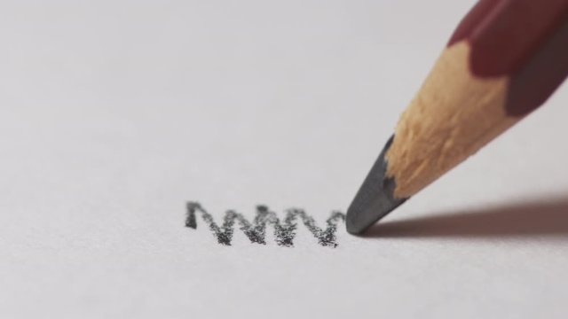 Artists hands drawing wooden pencil writes line on paper. Education handwriting exercise with red pencil. Dynamic closeup shot filmed in 4k UHD 2160p