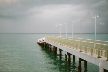 Jetty with a gloomy cloud