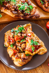 Sliced traditional Turkish pide with meat and vegetables
