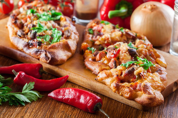 Sliced traditional Turkish pide with meat and vegetables