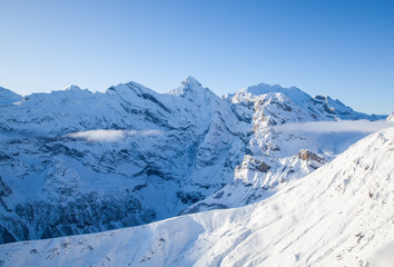 Fototapeta na wymiar amazing snow covered peaks in the Swiss alps Jungfrau region from Schilthorn
