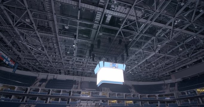 The luminous electronic sports scoreboard for the score under the roof of the hockey stadium while without a score, you can enter your values
