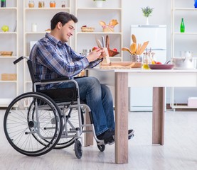 Young disabled husband preparing food salad