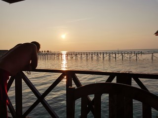 Beautiful sunset view in Mabul Island before heading to sunset dive. Mabul Island, Semporna. Sabah,...