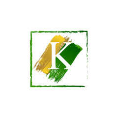 elegant K gold and green splash grunge alphabet logo letter