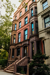 Brownstone facades & row houses at sunset in an iconic neighborhood of Brooklyn Heights in New York City