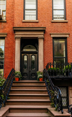Brownstone facades & row houses at sunset in an iconic neighborhood of Brooklyn Heights in New York City