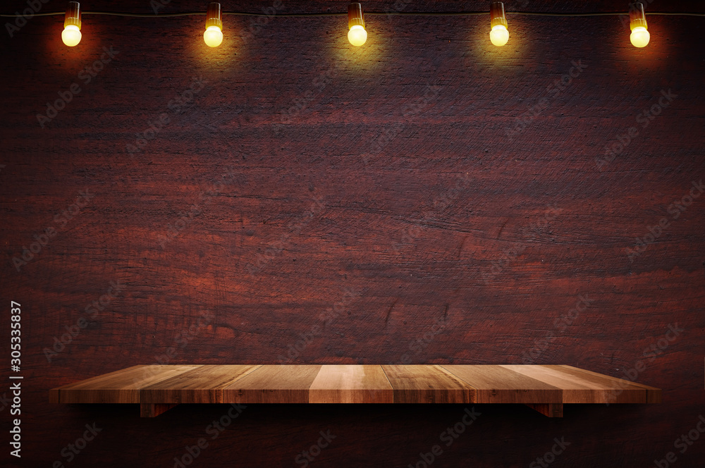 Aufkleber empty brown plank wood shelf at black red wooden wall background with light bulbs string,mockup for 