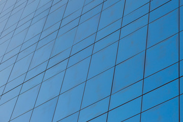Blue glass windows of modern office building