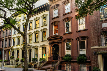Brownstone facades & row houses at sunset in an iconic neighborhood of Brooklyn Heights in New York...