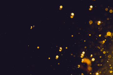 Abstract gold bokeh on black