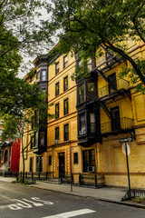 Brownstone facades & row houses at sunset in an iconic neighborhood of Brooklyn Heights in New York...