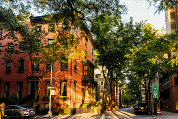 Brownstone facades & row houses at sunset in an iconic neighborhood of Brooklyn Heights in New York City