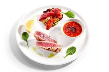 Tuna steak with grilled vegetables close up