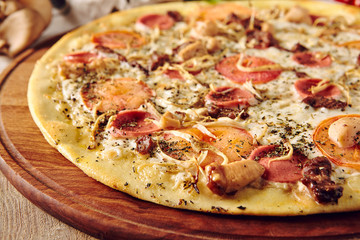 Pizza on wooden table top view