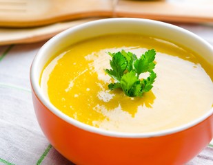 Pumpkin soup served on the table in bowl