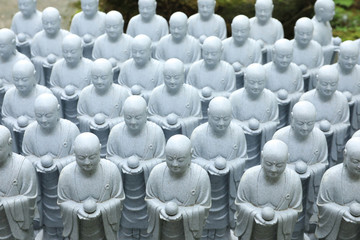 Fototapeta premium roll of Jizo Bodhisattva statues or statutes of baby buddha sat Hase-dera temple in Kamakura, Japan