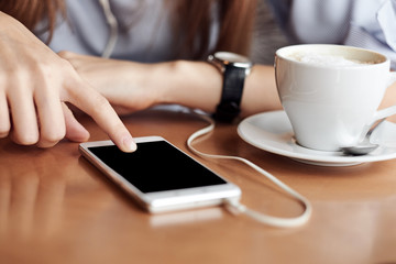 Business woman hands with smart phone and cup of coffee. For Graphic display montage.