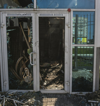 Burned construction with plastic door in summer