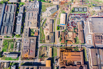 aerial panoramic view of city industrial district. industrial buildings of manufacturing companies with rusty roofs