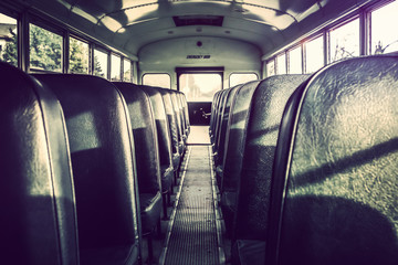 Dark shadowy empty interior of an old school bus