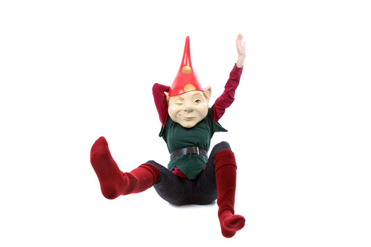 Person posing in an elf or gnome costume