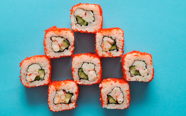 Japanese rolls on blue background.