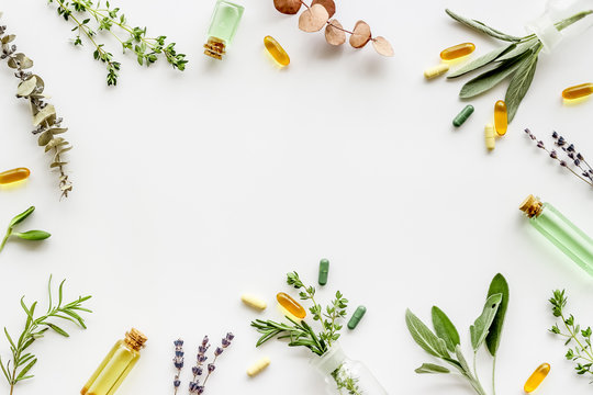 Apothecary of natural wellness and self-care. Herbs and medicine on white background top view frame copy space