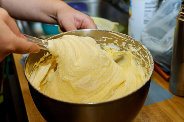 Mixing dough with hands for cake or sponge cake.