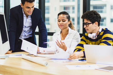 Young business design team having a meeting together in creative office.
