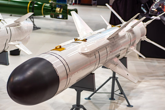 The rocket is white. Arms sale. Sale of weapons. Missile troops. Armed forces. Cruise missile. Army and weapons.