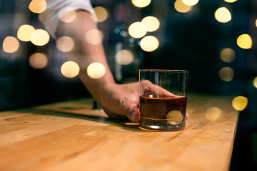 Barman pouring whiskey whiskey glass beautiful night