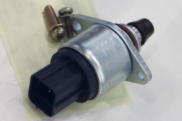 Car injector engine idler close up on white background