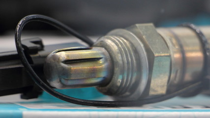 Car injector engine lambda oxygen sensor close up